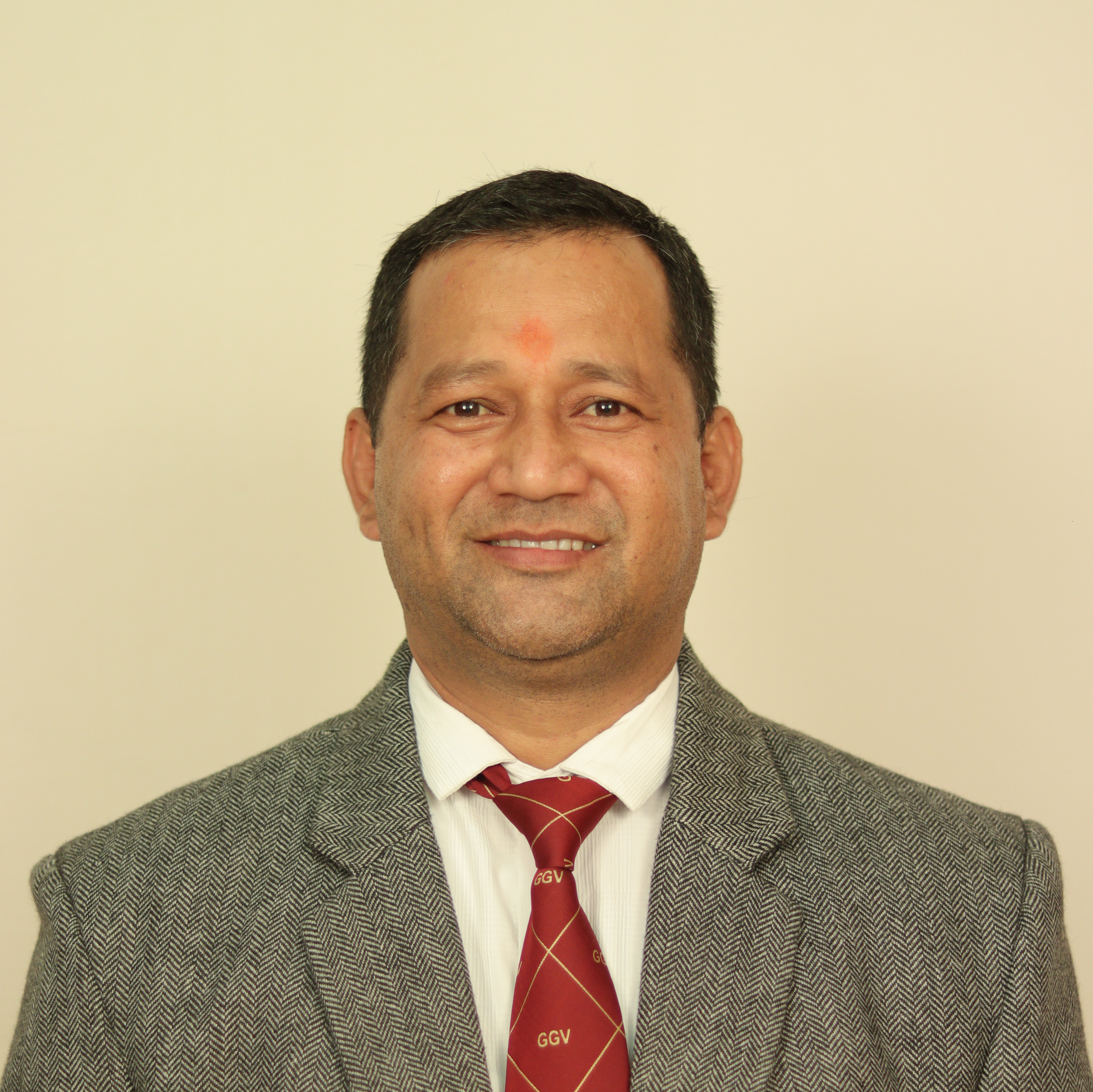 Dr. Mahesh Singh Dhapola